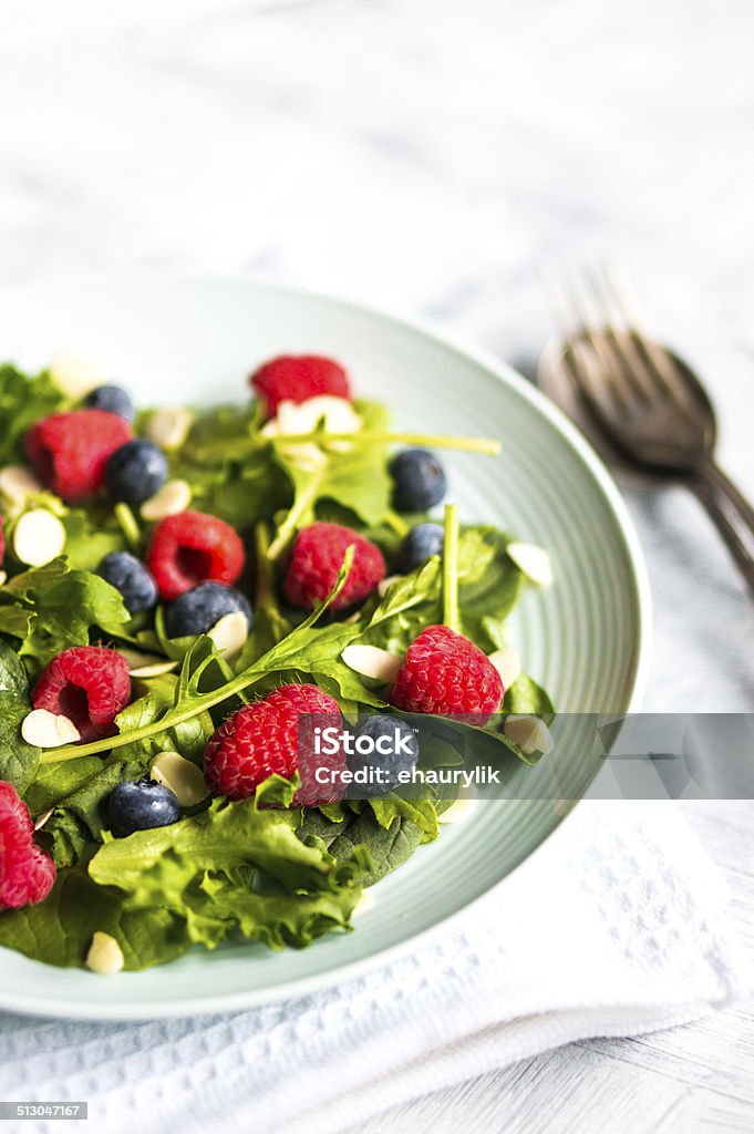 Green Salad With Berries And Almonds Stock Photo - Download Image Now