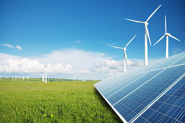 pannelli solari e mulini a vento power plant - renewable energy power line electricity fuel and power generation foto e immagini stock