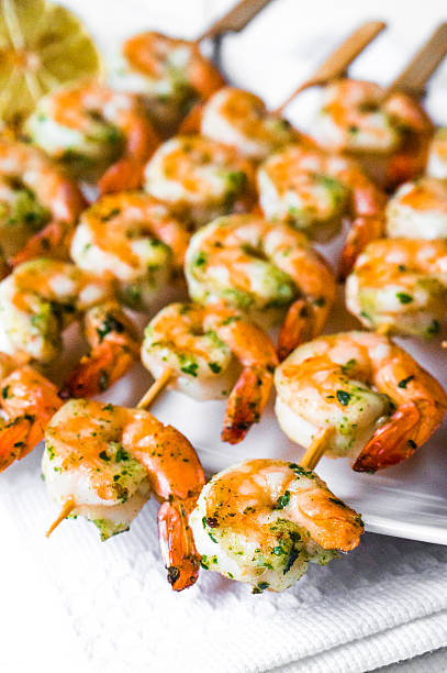 istock Grilled shrimps with limes 513049703