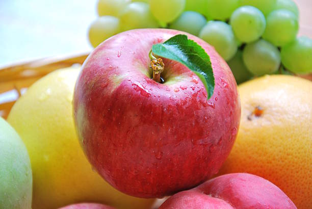 istock apple and fruits in basket 513051061