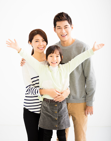 happy asian family standing together