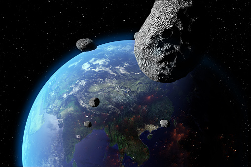 An illustration of asteroids approaching Earth. Earth land and clouds texture maps courtesy of NASA.gov