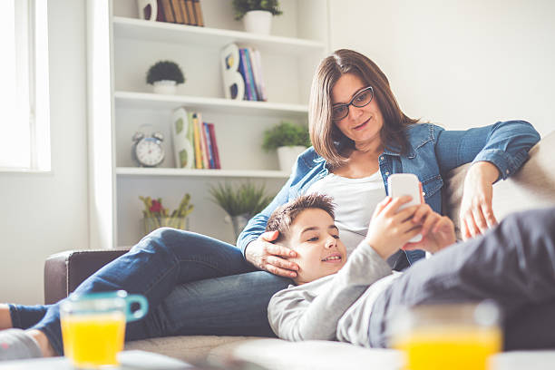 istock Mother and son looking at smart phone 513056918
