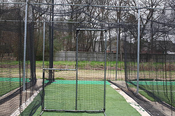 Batting Cage Pitch Baseball Netting Batting Cage Pitch Baseball Netting baseball cage stock pictures, royalty-free photos & images