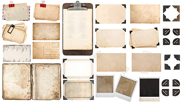 Paper sheets, book, old photo frames corners, clipboard stock photo
