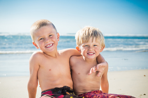 Two elementary age children of Indian ethnicity loving portrait outdoor in nature.