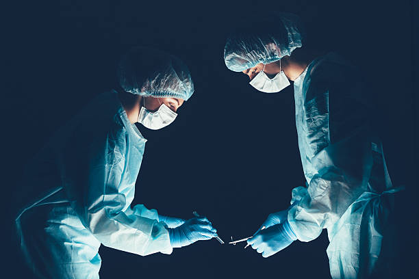Medical team  hospital performing operation. Group of surgeon at work