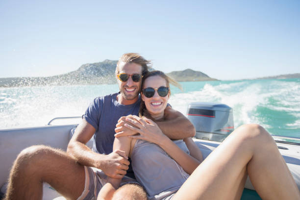 istock Couple sitting on boat together 513066377