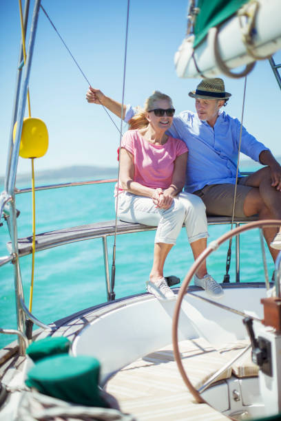 istock Couple sitting in boat together on water 513066641