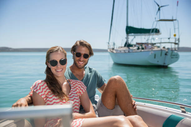 istock Couple sitting in boat on water 513066913