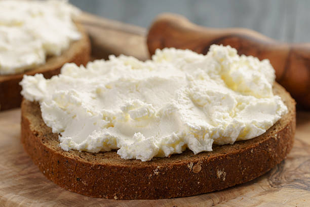 istock rye bread with cream cheese on wood table 513069692