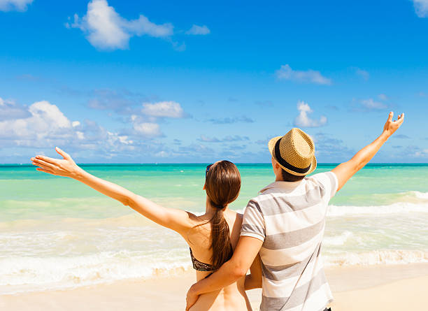 istock Happy couple enjoying summer beach 513070160