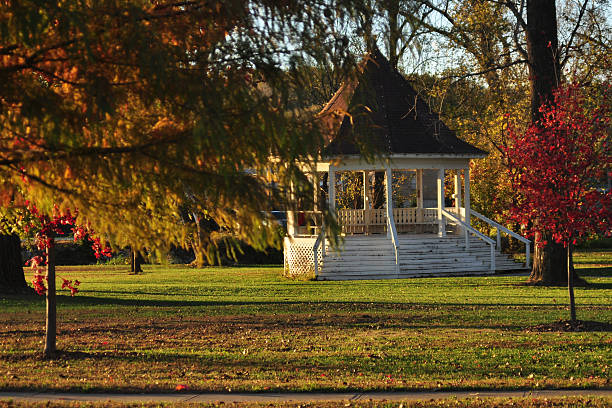 istock White Gazebo with Autumn Foliage 513070773