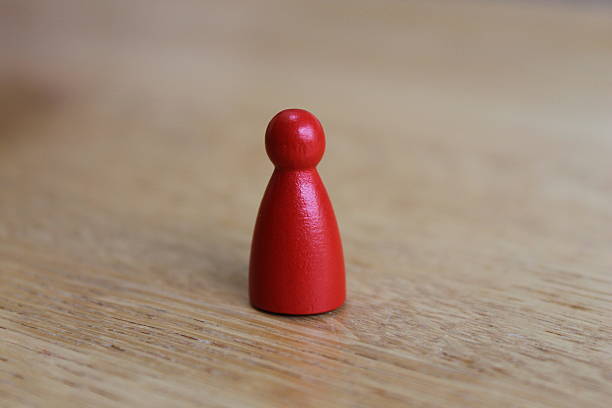 istock Red wooden game piece 513071039