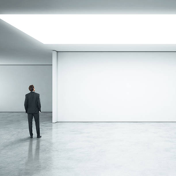 istock Businessman standing in bright office 513071341