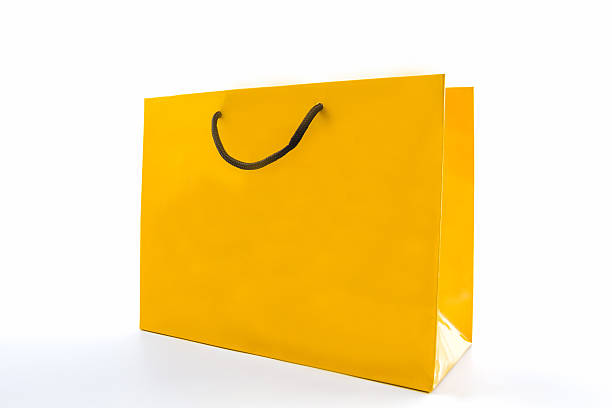 istock Blank yellow paper shopping bag. 513071575