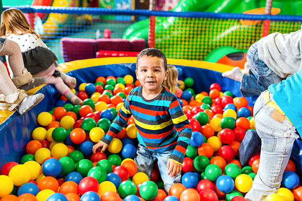 istock African American boy in ball pool. 513072043