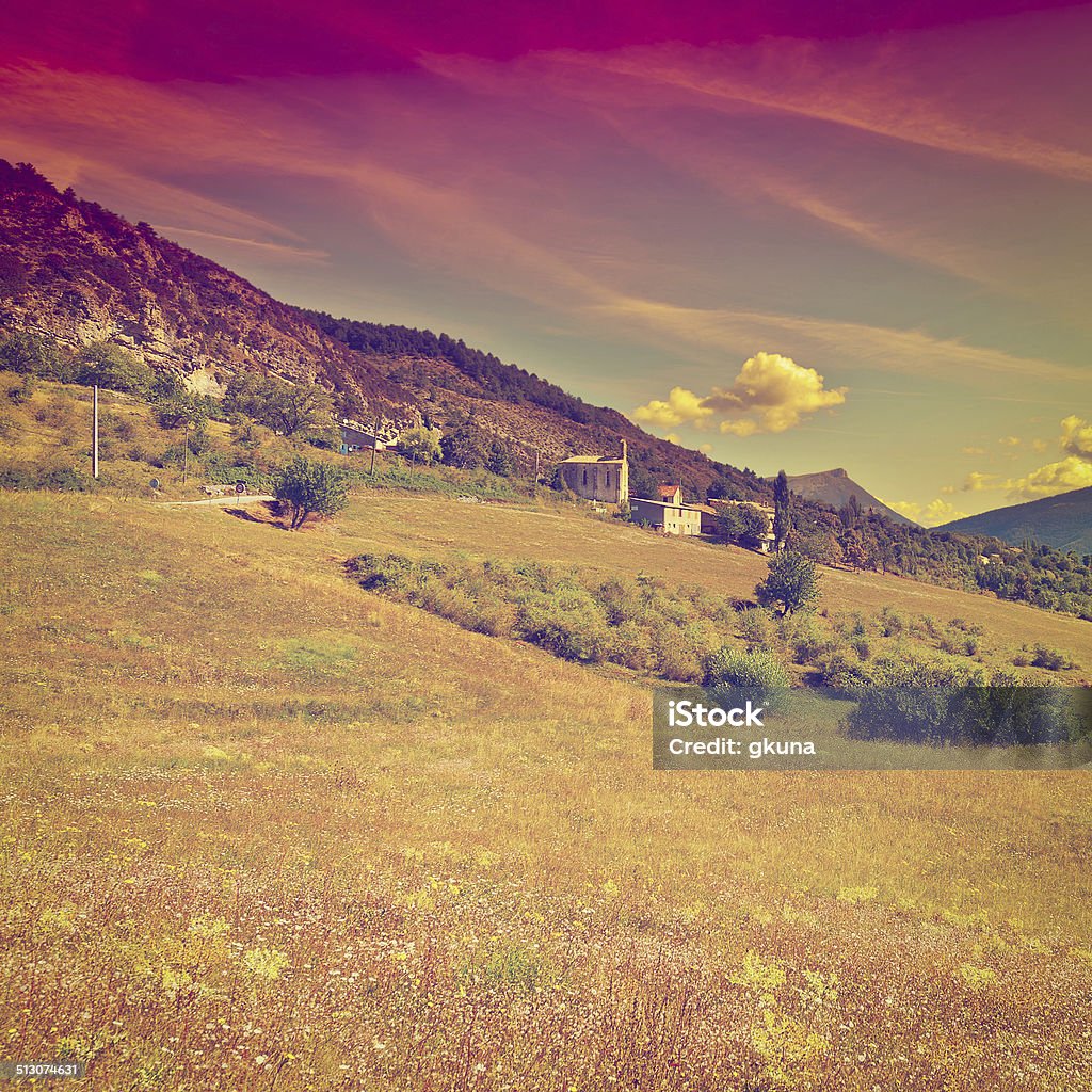 Small Village The Small Village High Up in the French Alps at Sunset, Retro Effect Agricultural Field Stock Photo