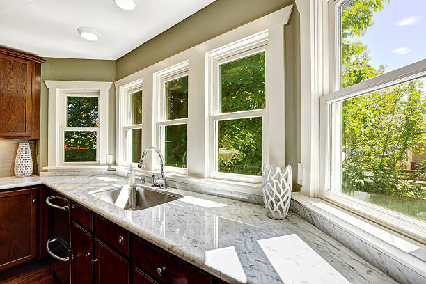 kitchen cabinet with marble top and sink - aanrecht fotos stockfoto's en -beelden