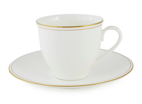 Cup and saucer on white background