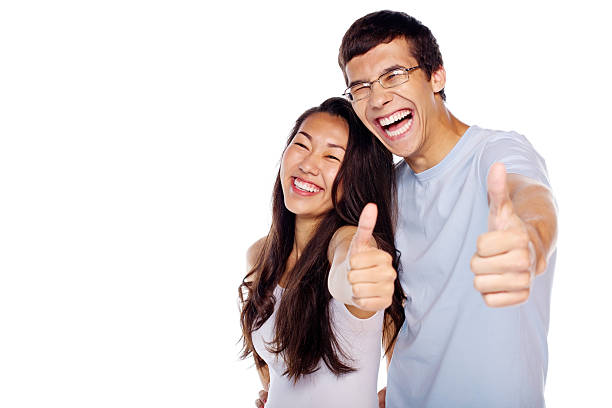 Couple showing thumbs up