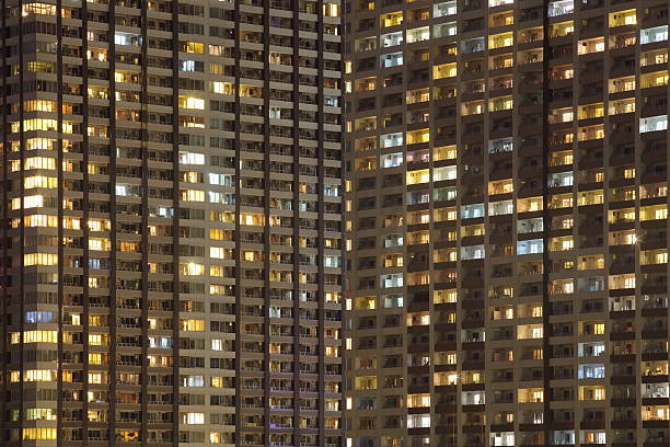 istock modern high condominium at night time 513098803