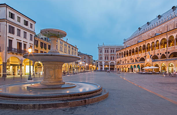 Padua, Italy - September 9, 2014: Piazza delle Erbe in evening dusk and Palazzo della Ragione.
