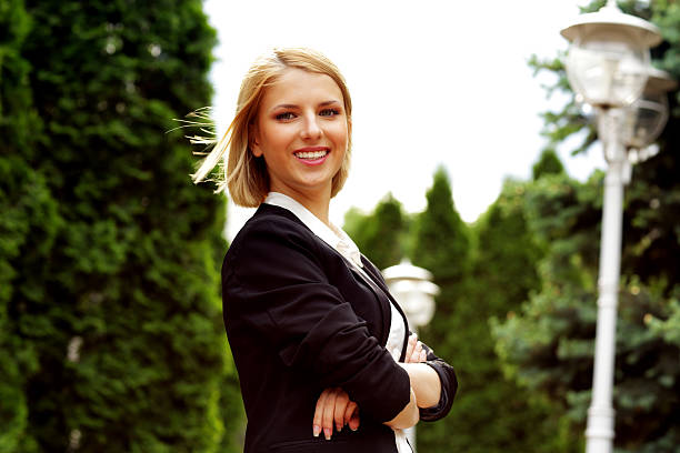 istock attractive woman with arms folded in park 513101299