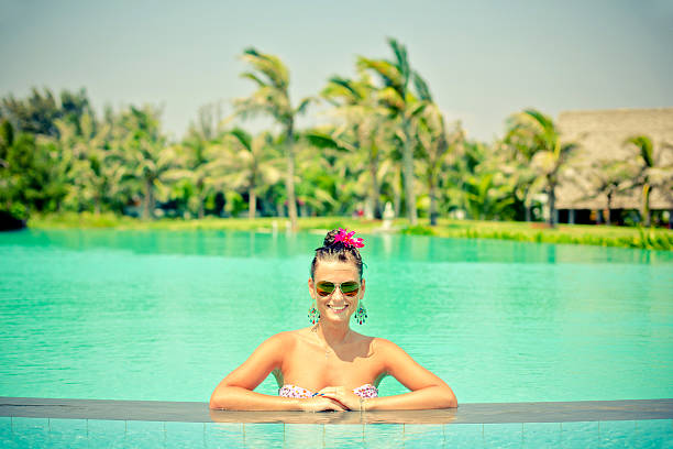 istock Woman relaxing in the pool in summer. 513102485