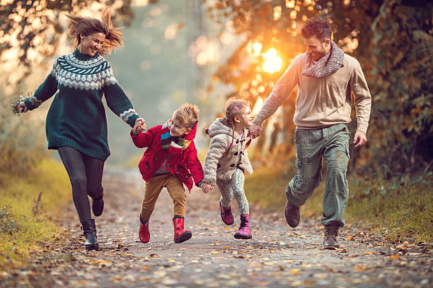 istock Young playful family having fun while running in the park. 513102950