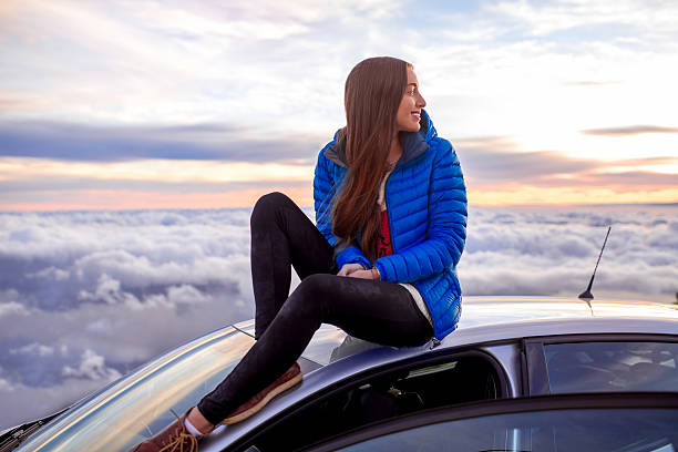 istock Woman enjoying beautiful cloudscape 513103344