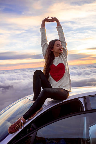 istock Woman enjoying beautiful cloudscape 513103482