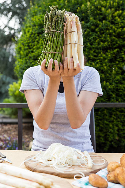 istock woman is holding sundry asparagus 513105874