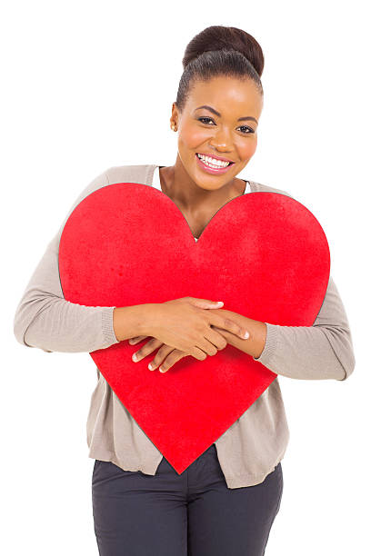 istock young african woman hugging red heart shape 513106687