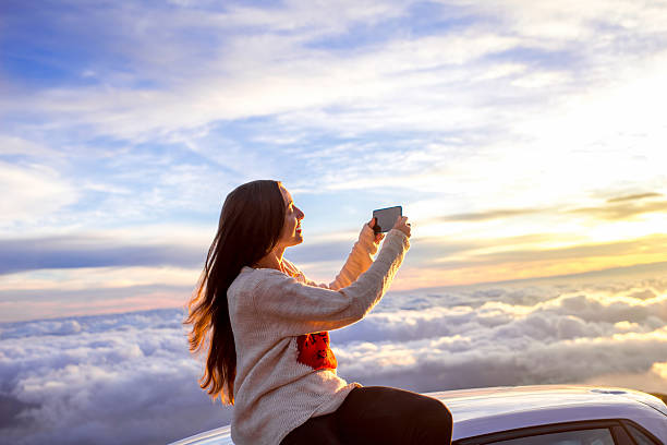 istock Woman enjoying beautiful cloudscape 513107272