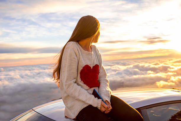 istock Woman enjoying beautiful cloudscape 513107764