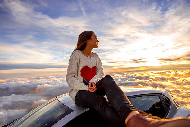 istock Woman enjoying beautiful cloudscape 513107852