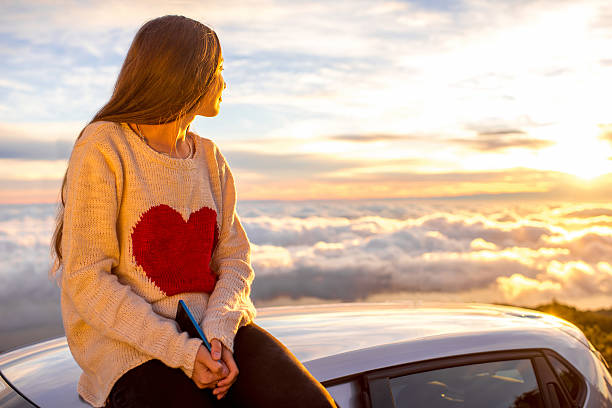 istock Woman enjoying beautiful cloudscape 513107958