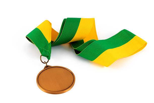 istock Gold medal on yellow green ribbon 513108172