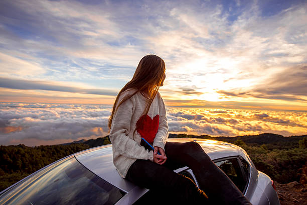 istock Woman enjoying beautiful cloudscape 513108216