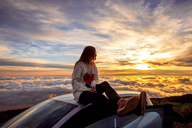 Photo of Woman enjoying beautiful cloudscape
