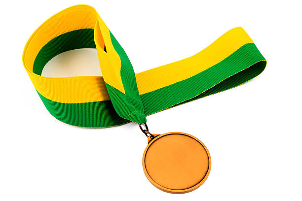 istock Gold medal on yellow green ribbon 513108356