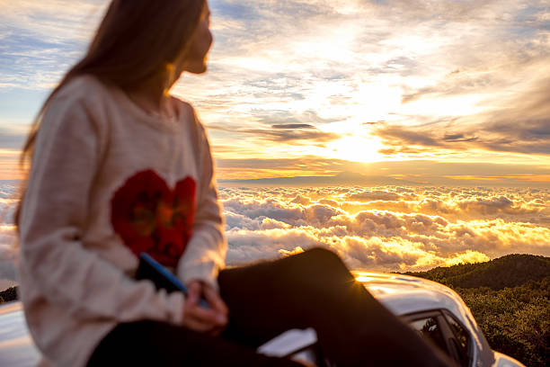 istock Woman enjoying beautiful cloudscape 513108566
