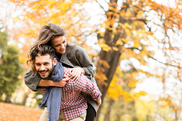 istock Young couple in the autumn forest 513108574