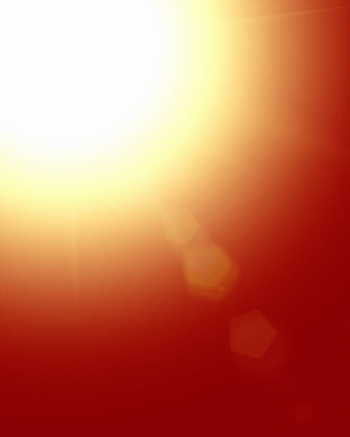 istock Blazing sun with radiating lens flare on orange 513108632