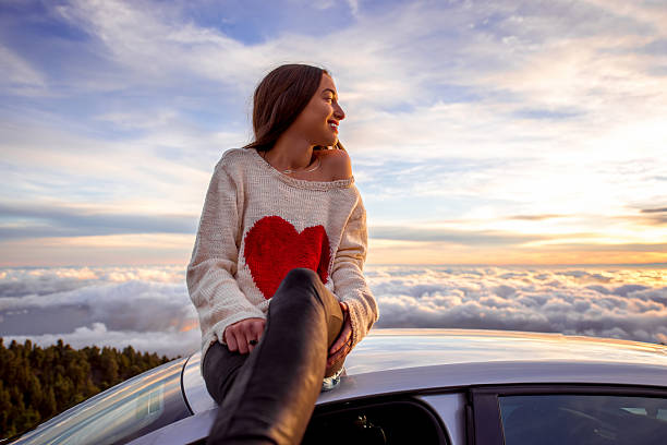 istock Woman enjoying beautiful cloudscape 513109000