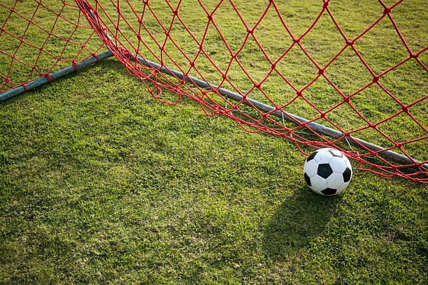 istock Football inside red goal net 5 513111912
