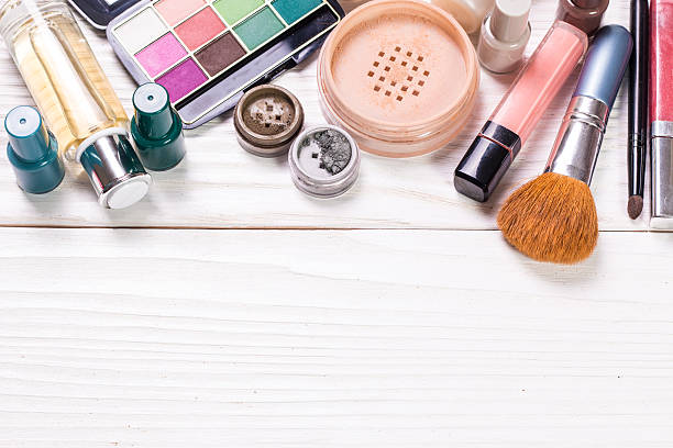 istock Various makeup products on wooden background with copyspace 513112074