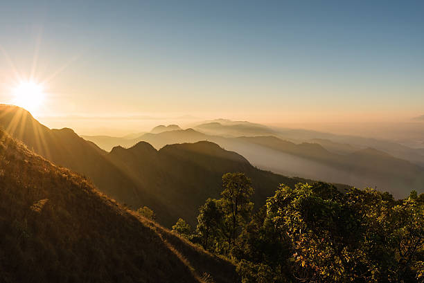 istock Bright sun shining over the golden mountain 513112402