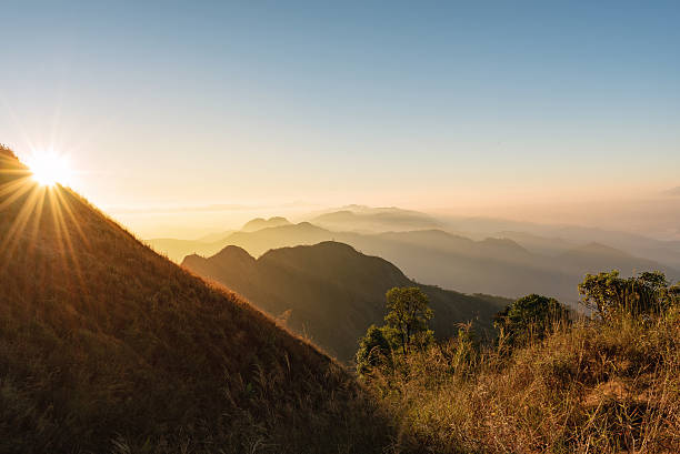 istock Bright sun shining over the golden mountain 513112516